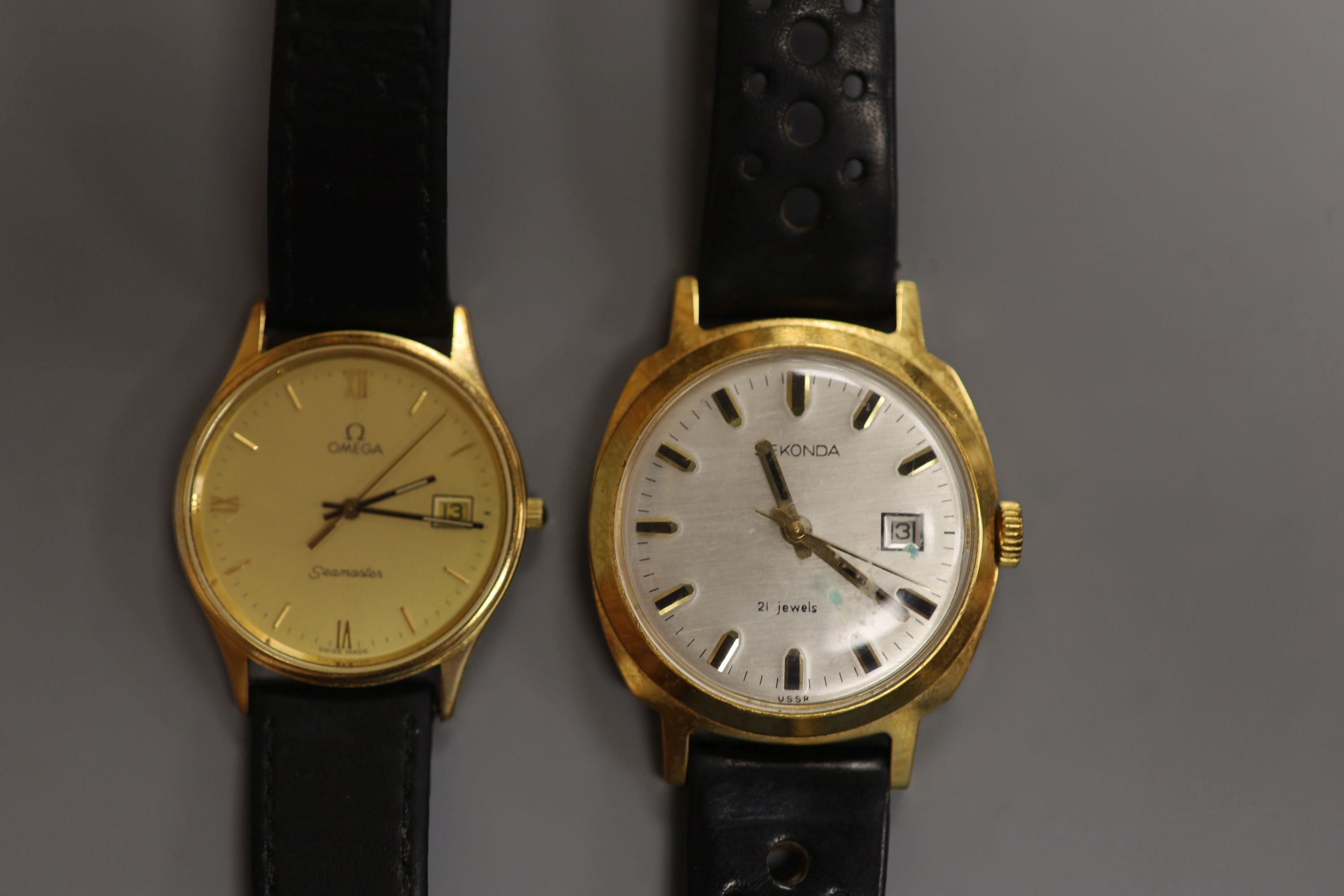 A gentleman's Omega Seamaster 9ct gold quartz watch, on a leather strap, gross 27.6 grams and a Sekonda watch.